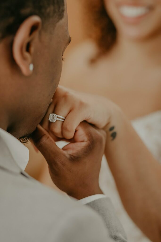 man in white shirt wearing silver ring